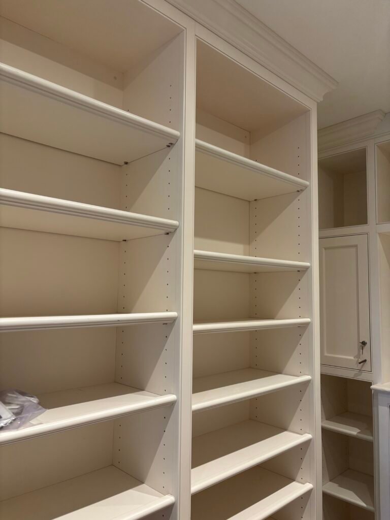 White built-in closet shelving installed, NYC apartment