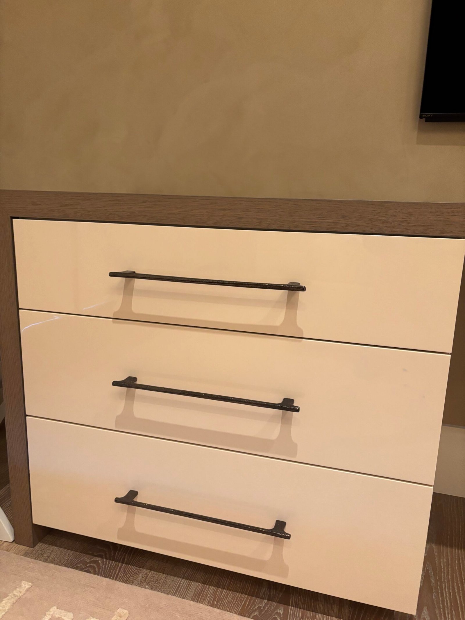 White drawers with black bar pulls installed, NYC