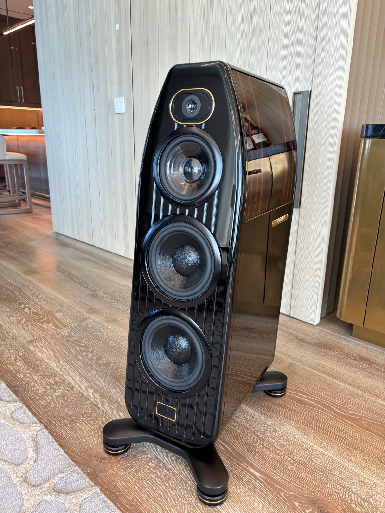 Floor-standing speaker installed next to a fluted wall, NYC