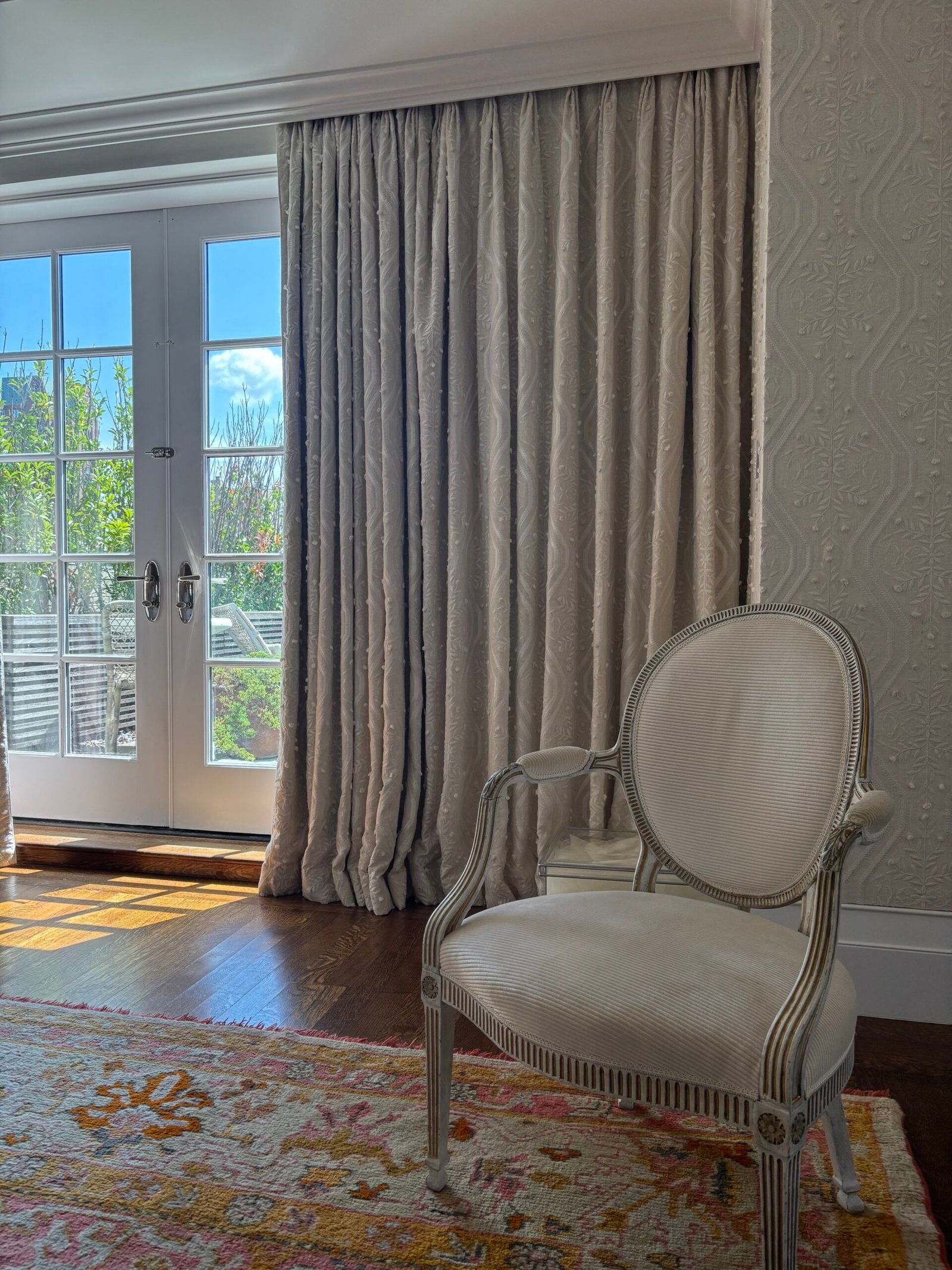 Floor-length curtains installed on French doors, NYC