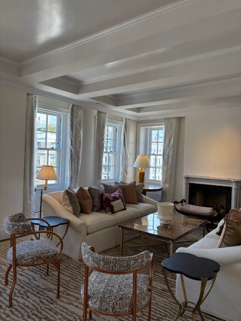 Living room with fireplace and sofa in a pre-war NYC apartment