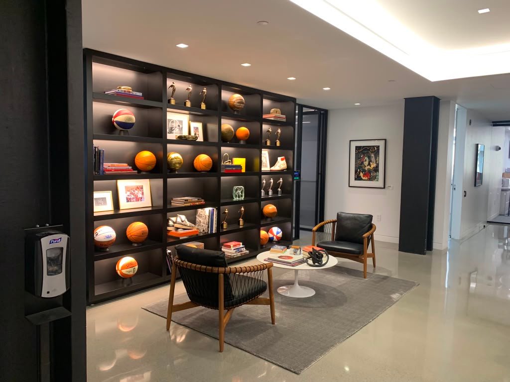 Custom shelving wall installation with display lighting, NYC
